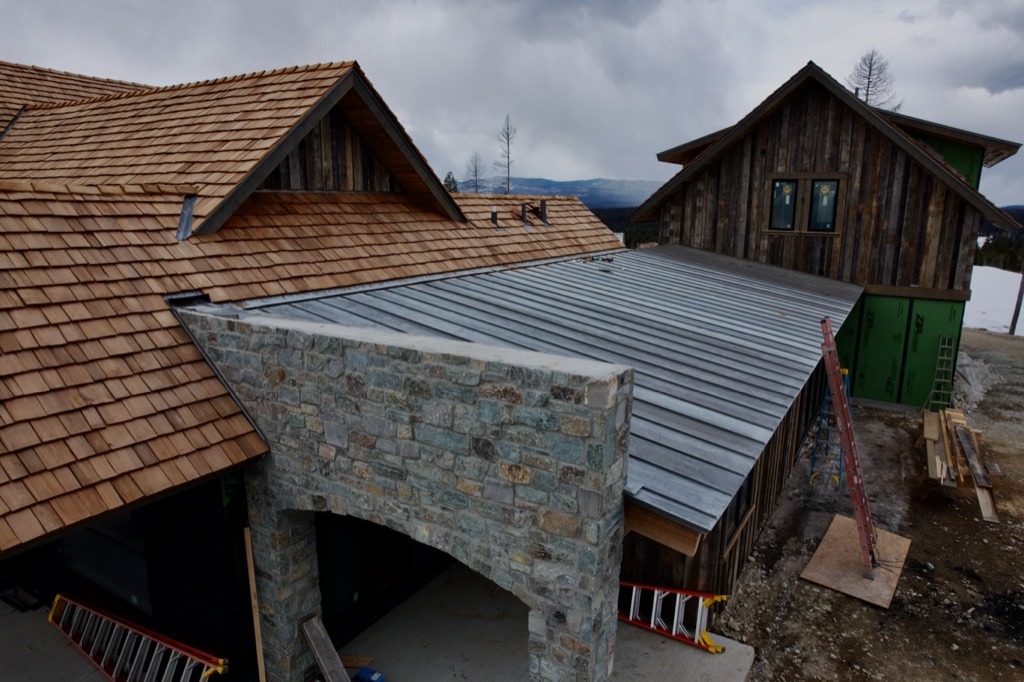 Bonderized standing seam run against natural cedar shake