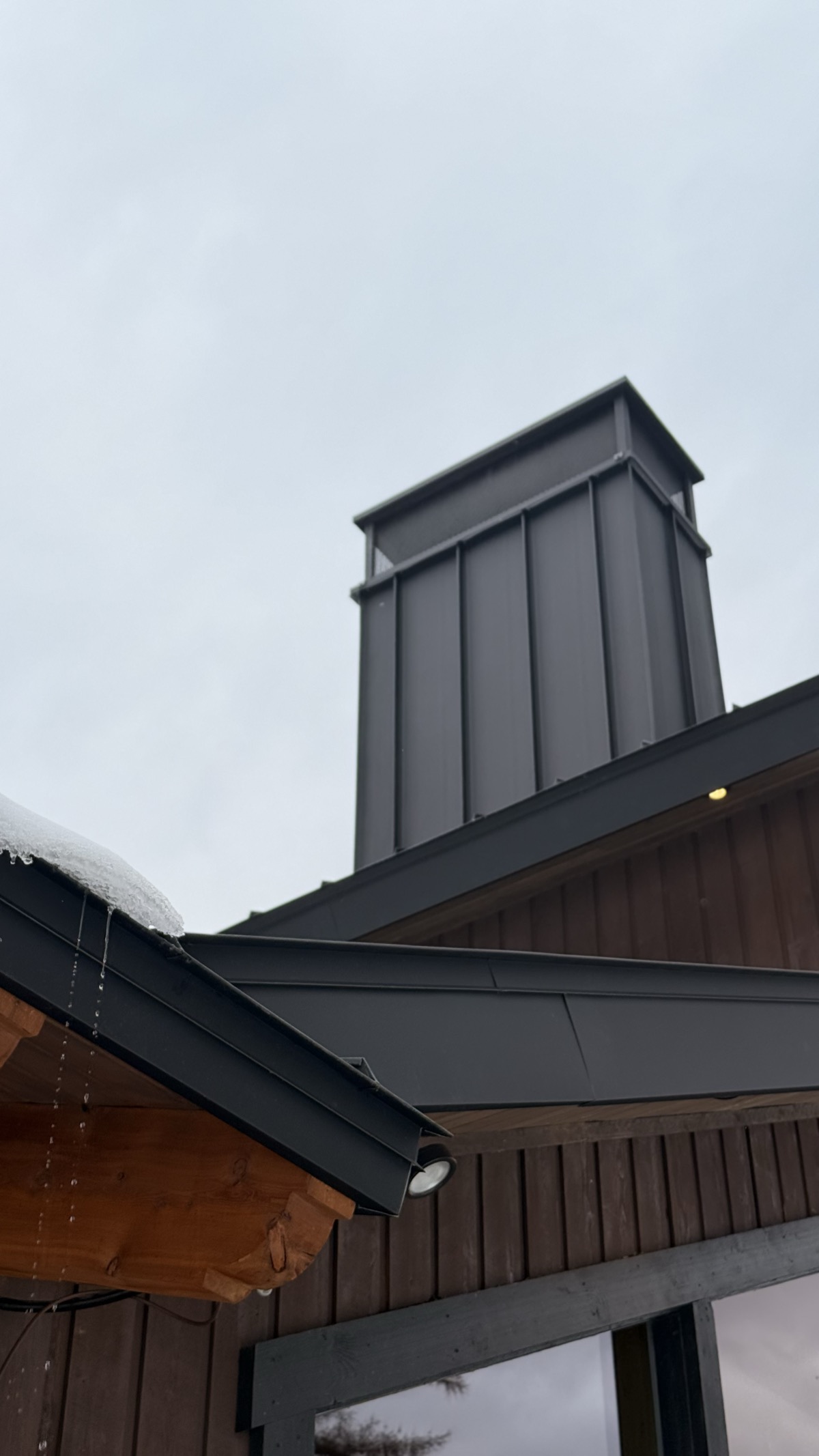 Chimney flashing and wrapped fascia, zero exposed fasteners
